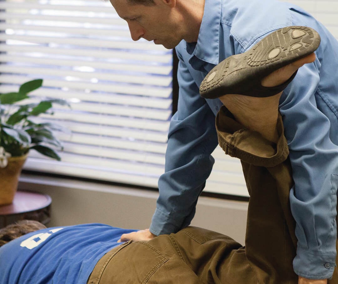 Brandt Adams chiropractor adjusting a client Brandt Adams chiropractor adjusting a client