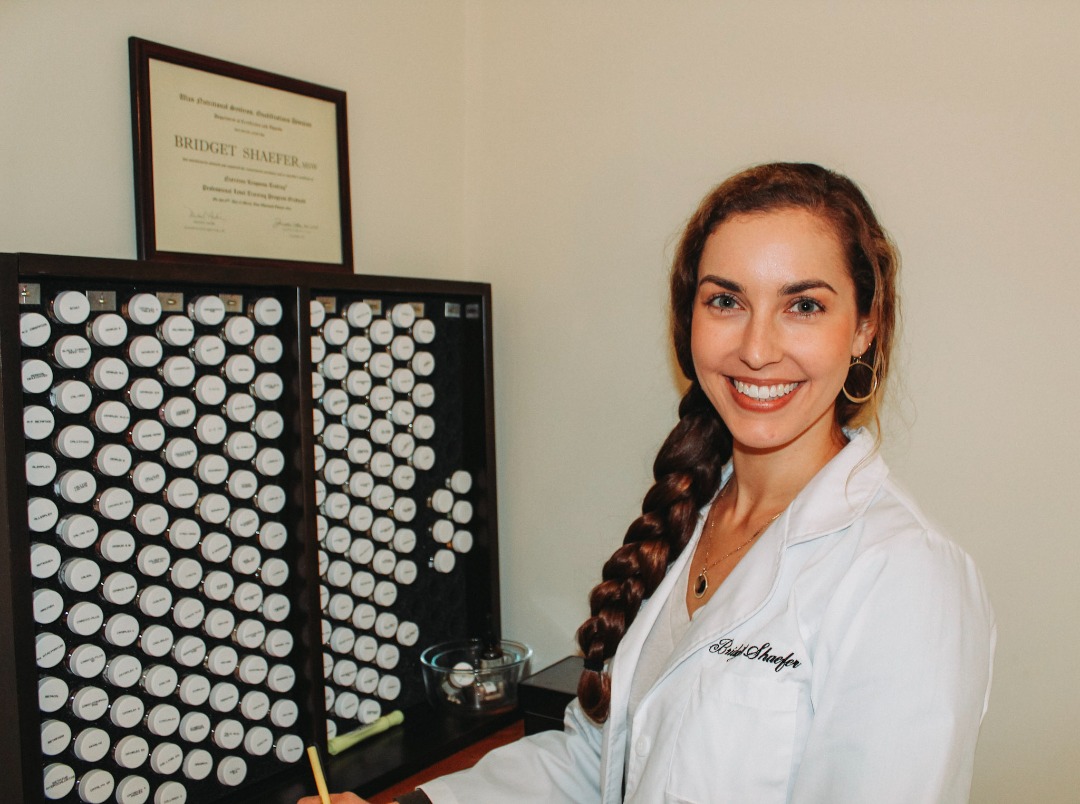 NRT Practitioner, Bridget Shaefer, practicing a type of muscle testing (NRT) on a patient.